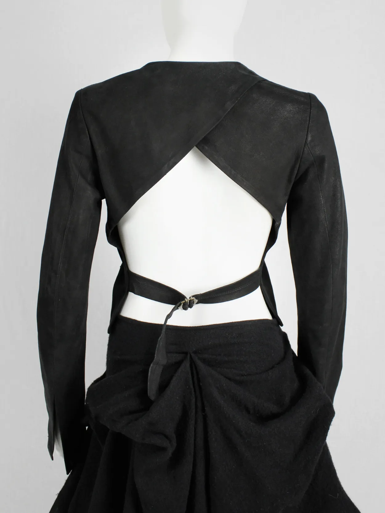 Isaac Sellam black leather jacket with open back and belt strap