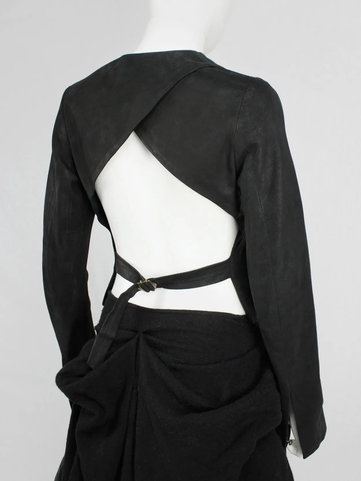 Isaac Sellam black leather jacket with open back and belt strap